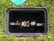 Backflow assembly in irrigation box